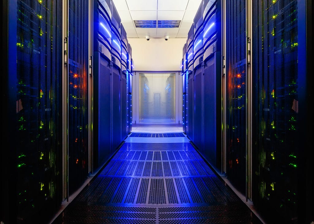 data center room with futuristic beams and rows of equipment